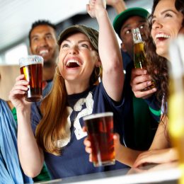 group of sports fans cheering together