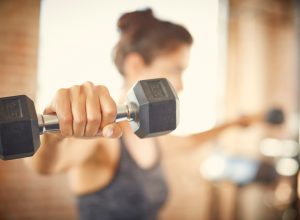 Woman exercising with dumbbells.