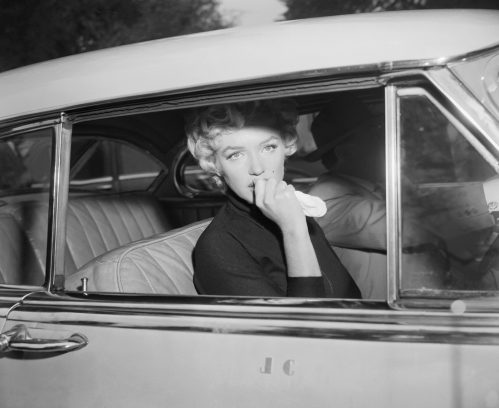 Marilyn Monroe photographed leaving the home she shared with Joe DiMaggio after announcing their divorce in 1954