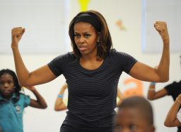 MIAMI, FL - FEBRUARY 25: First Lady Michelle Obama participates in a yoga class during a visit to the Gwen Cherry Park NFL/YET Center as she celebrates the 4th Anniversary of Let's Move on February 25, 2014 in Miami, Florida. (Photo by Larry Marano/WireImage)