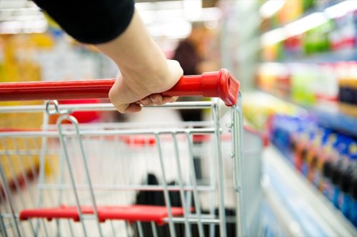 Closeup of woman with shopping cart.