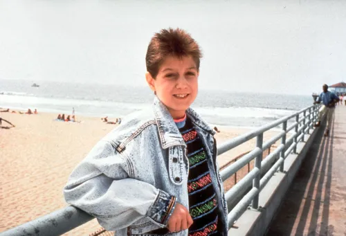 Ryan White photographed on a beach boardwalk