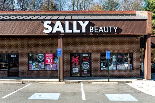 Sally Beauty Supply store in plaza shopping center strip mall sign in Virginia with parking lot, shops