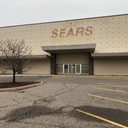 The parking lot of a closed down Sears location
