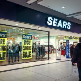 A Sears location with store closing signs in the window