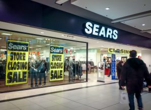 A Sears location with store closing signs in the window