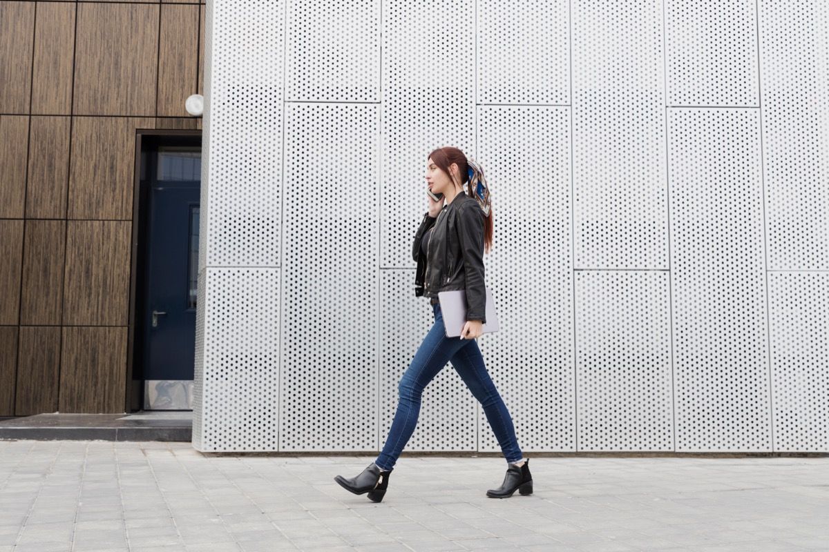 Woman Walking While Talking on Phone