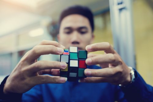 Person Solving a Rubix Cube