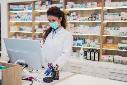Female Pharmacist Behind the Counter