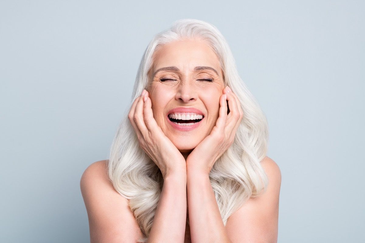 Woman with gray hair laughing