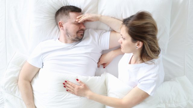 Man and Woman Struggling in Bed
