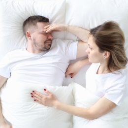 Man and Woman Struggling in Bed