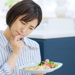 Woman Struggling to Eat