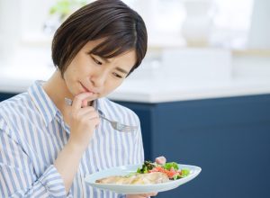 Woman Struggling to Eat