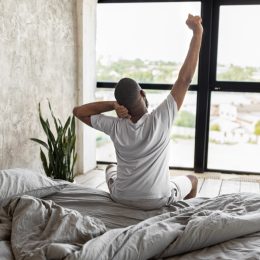 Person Stretching After Good Night's Sleep