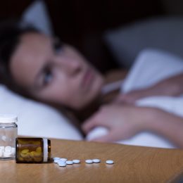 Woman Trying to Sleep with Pills