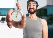 Man Holding Stopwatch for Exercising