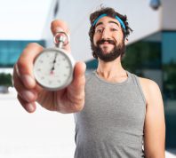 Man Holding Stopwatch for Exercising