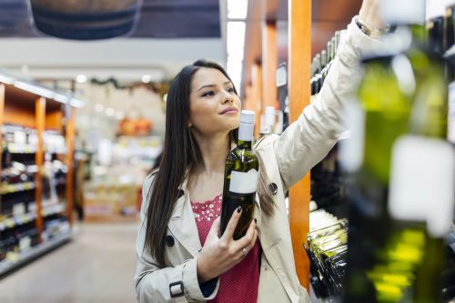 woman buying alcohol at the store
