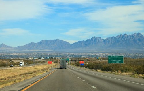 a highway surrounded by mountains
