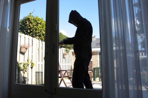 burglar entering through back door