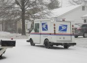 St. Peters, United States – December 23, 2008: A US Postal Service vehicle out delivering the mail during a snowstorm in Missouri