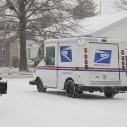 St. Peters, United States – December 23, 2008: A US Postal Service vehicle out delivering the mail during a snowstorm in Missouri