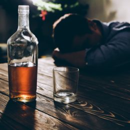 Man struggling with alcohol addiction.