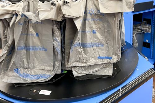 Orlando, FL, USA - January 25, 2022: Single use plastic shopping bags at the checkout counter in a Walmart store.