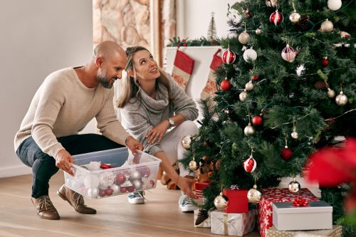 Couple Decorating a Christmas Tree