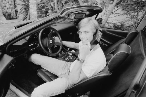 Christopher Atkins photographed in a car in 1983