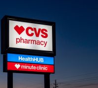 A CVS Pharmacy store sign at night is shown in Houston, Texas, USA. CVS Pharmacy is an American retail corporation.