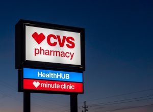 A CVS Pharmacy store sign at night is shown in Houston, Texas, USA. CVS Pharmacy is an American retail corporation.