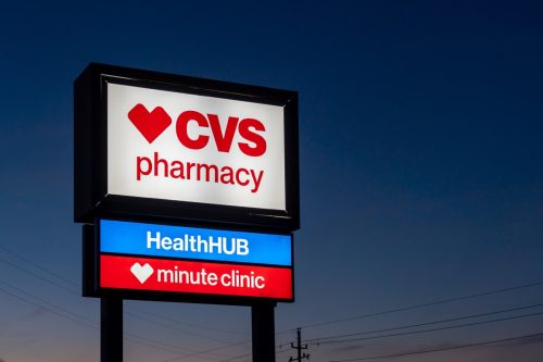 A CVS Pharmacy store sign at night is shown in Houston, Texas, USA. CVS Pharmacy is an American retail corporation.