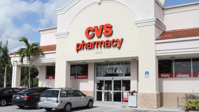 "West Palm Beach, USA - July 27, 2012: A CVS Drugstore Pharmacy store with cars parked in the front parking lot. CVS is one of the largest drugstore chains in the USA."