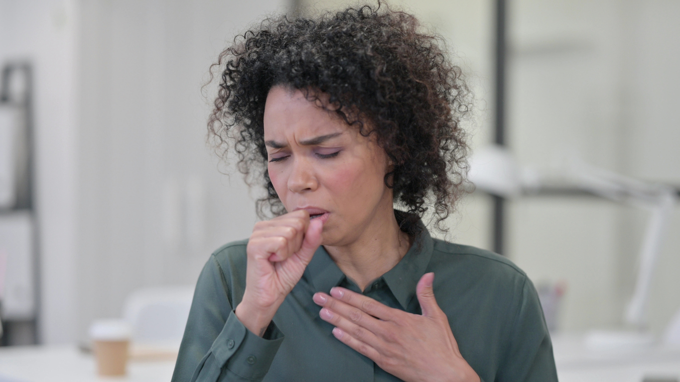 Woman coughing. 