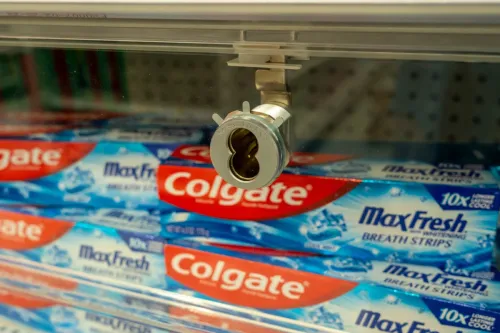 Tubes of Colgate-Palmolives Colgate toothpaste are locked up to deter shoplifters in a store in New York
