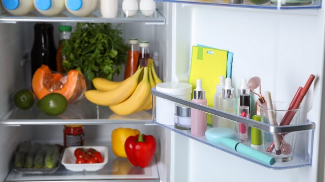 Storage of cosmetics and tools in refrigerator door bin next to groceries