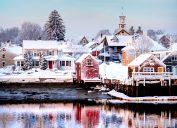 View across the lake of snow-covered houses in Portsmouth, New Hampshire.