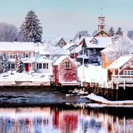 View across the lake of snow-covered houses in Portsmouth, New Hampshire.