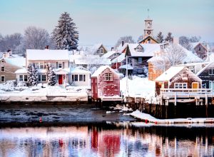 View across the lake of snow-covered houses in Portsmouth, New Hampshire.