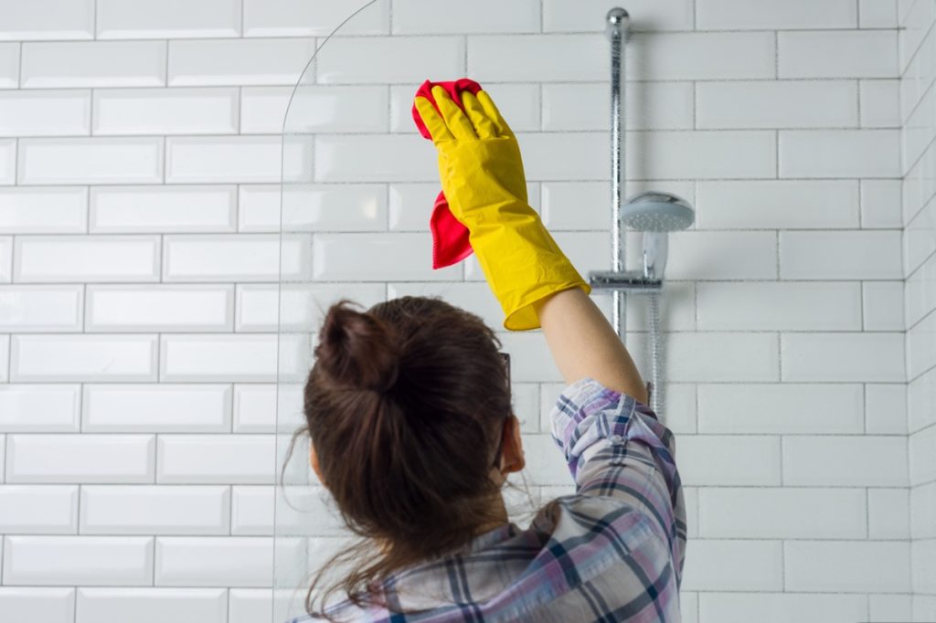Woman cleaning in the bathroom at home