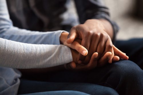 man and woman holding hands building trust