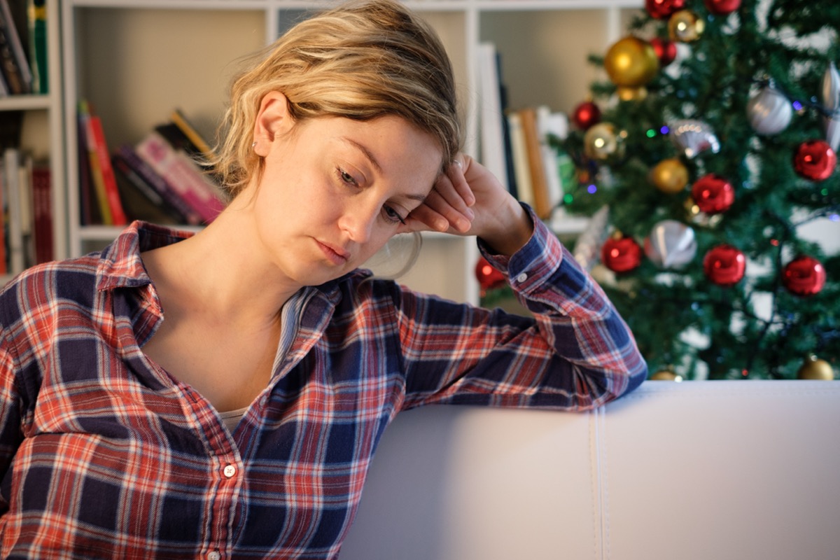 Sad christmas days for lonely woman at home
