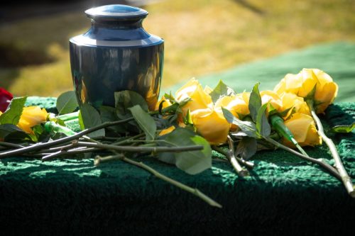 Cremated remains with yellow flowers.
