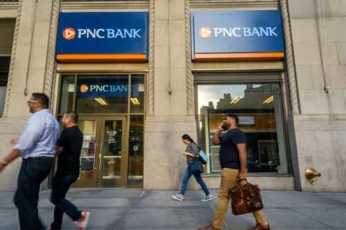 people walking in front of PNC bank location