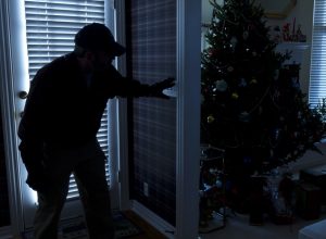 thief breaking in during the holidays