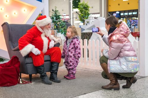 santa visiting with little girl