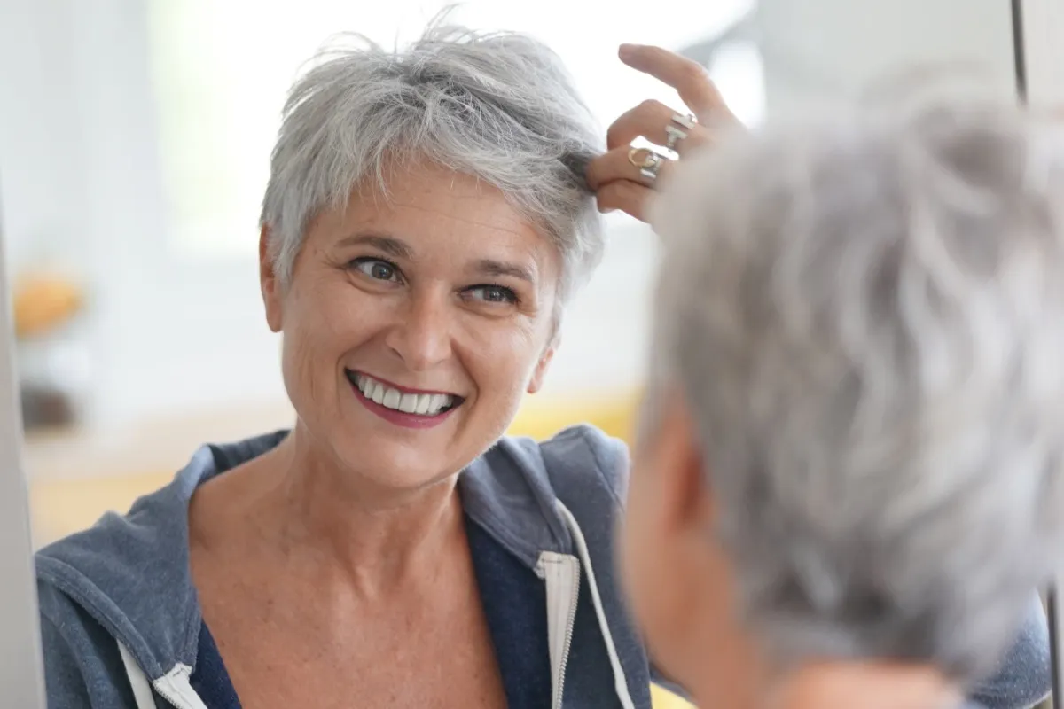 Woman Styling Gray Hair