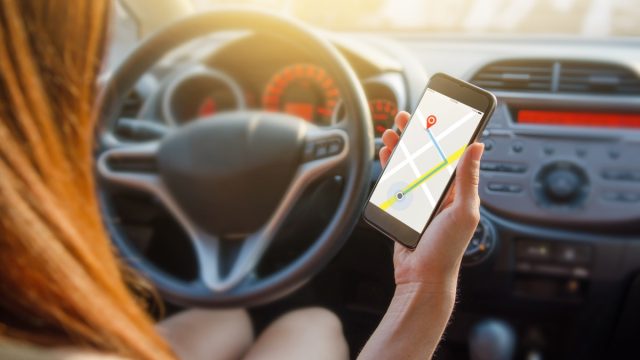 woman using driving navigation app
